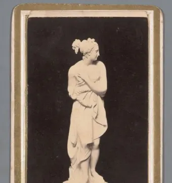 Venus Italica by Canova, a standing female sculpture with arms crossed over her chest and draped fabric.