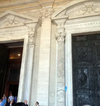 Filarete Door with dark bronze panels depicting figures and scenes on St. Peter\'s Basilica