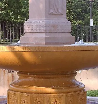 Butt-Millet Memorial Fountain inscription on a stone basin with gently bubbling water