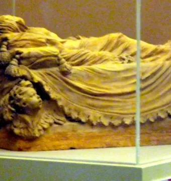 Veiled Christ bozzetto showing a recumbent figure draped in delicate fabric on an ornate base