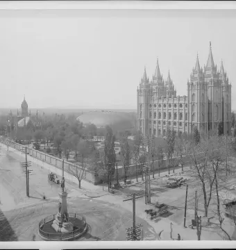 Brigham Young Monument standing on a circular street island in Salt Lake City.