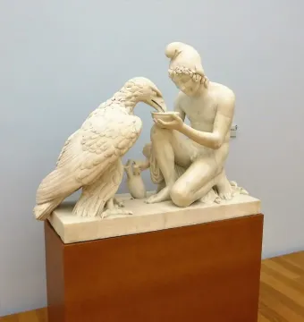 Ganymede with Jupiter\'s eagle marble sculpture of an eagle drinking from a bowl held by a kneeling male figure