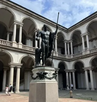 Napoleon as Mars the Peacemaker, a bronze nude statue on a hexagonal pedestal in the Brera courtyard.