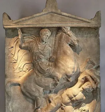 Stele of Dexileus showing a cloaked rider on a rearing horse above a fallen figure, with an inscribed stone base below.