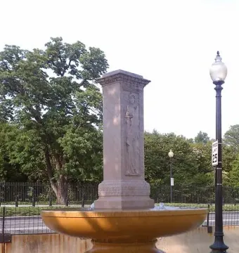 Butt-Millet Memorial Fountain with a light-colored central pillar, relief figure, and broad stone basin.