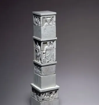 The Nautae Parisiaci Pillar, a tall stone monument with stacked carved blocks and relief figures.