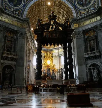St. Peter\'s Baldachin beneath the ornate dome of St. Peter\'s Basilica