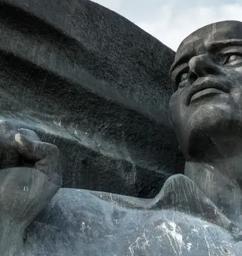 Ernst Thälmann Memorial showing the statue’s head and clenched fist against a textured background