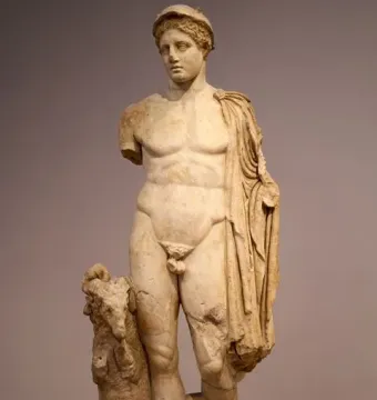 Hermes Criophorus marble statue of a youthful nude figure beside a ram, with a cap and drapery over one shoulder.