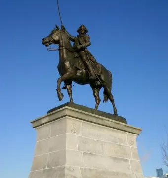 Tadeusz Kościuszko Monument showing a bronze equestrian statue of a man in military attire with a raised sword on a stone pedestal.