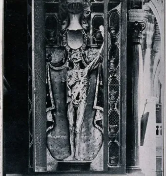 The Transi of René of Chalon, an upright skeletal figure in an ornate architectural niche with columns and draped details.