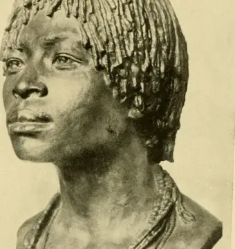 Bronze bust of Woman of Central Africa with short textured hair and layered beaded necklaces on a dark base.