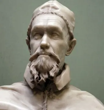 Marble bust of Pope Innocent X with a curly beard, mustache, and clerical cap.