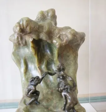 The Wave by Camille Claudel, with three nude bathers integrated into a cresting stone wave.