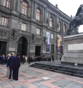 El Caballito, a bronze equestrian statue on a stone pedestal in a city square with people nearby