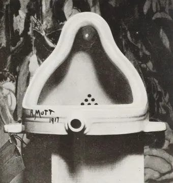 Black-and-white photograph of Duchamp’s Fountain, a ceramic urinal signed R. Mutt 1917.