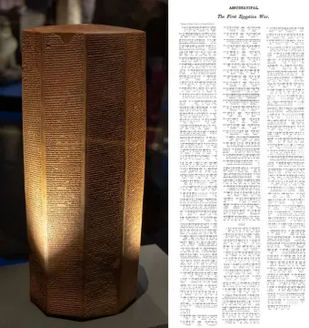 The Rassam cylinder, a tall reddish-brown inscribed prism covered in dense horizontal text lines.