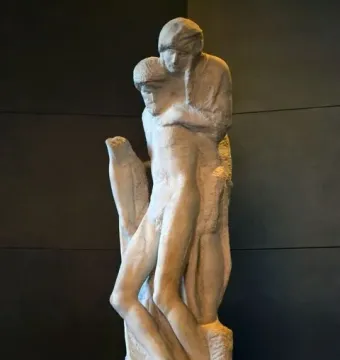 The Rondanini Pietà, a tall unfinished marble sculpture of two intertwined figures on a stone pedestal.