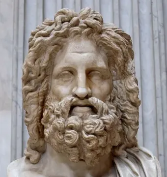 Zeus of Otricoli marble bust with a curly beard and draped shoulder, shown before fluted columns.