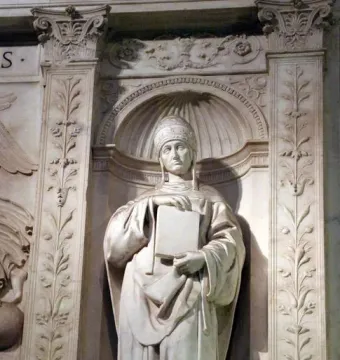 Saint Gregory marble statue in an ornate arched niche, holding a large book and wearing a papal tiara.