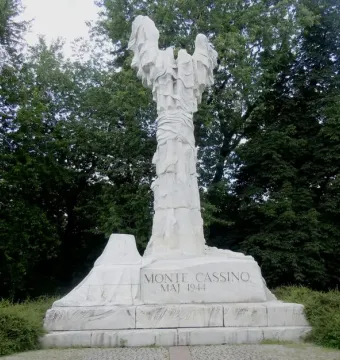 Monument to the Battle of Monte Cassino, a tall white sculptural figure on a column with the inscription \