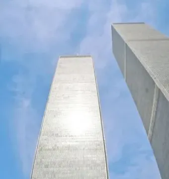 Cloud Fortress in the foreground with the Twin Towers rising behind it against a blue sky.