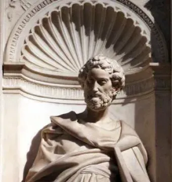 Marble statue of Saint Peter holding a key in an ornate niche.