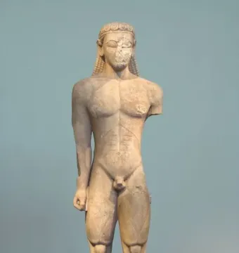 Sounion Kouros, a damaged ancient marble male statue with braided hair and a missing nose.