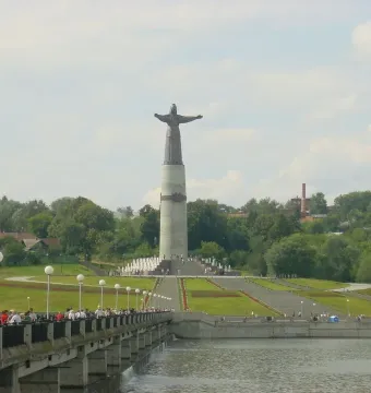 Mother Patroness statue on a tall pedestal above a terraced staircase with fountains in Cheboksary.