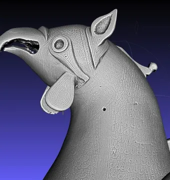 Grayscale 3D scan of the Pisa Griffin showing the head and upper body with an open beak, pointed ears, and textured detailing.