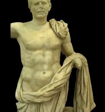 General of Tivoli marble statue of a draped male figure beside a small support, shown against a black background.