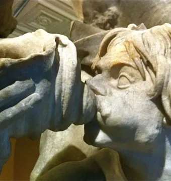 Detail of Bernini\'s Neptune and Triton showing Triton in profile blowing a shell.