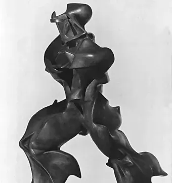 Unique Forms of Continuity in Space, a dark bronze-like sculpture of a striding figure with flowing, aerodynamic forms.