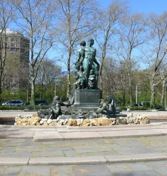 Bailey Fountain sculpture in a circular stone basin in a Brooklyn plaza