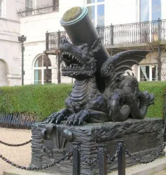 Cádiz Memorial sculpture of a winged dragon-like creature supporting a cannon barrel