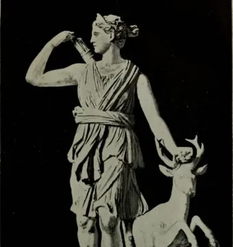 Diana of Versailles, a classical statue of a draped female figure reaching for an arrow with a small deer beside her.