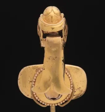 Serpent labret with articulated tongue shown from above on a black background.