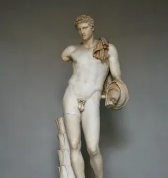 Hermes Belvedere marble statue of a standing nude male figure with curly hair and a draped cloak.