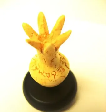 Ivory Pomegranate reconstruction with an inscription around its rounded body