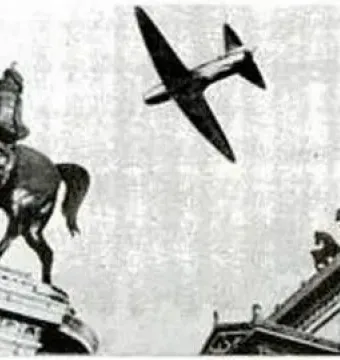 A low-flying airplane passes near the Victor Emmanuel II Equestrian Statue and a classical rooftop quadriga.