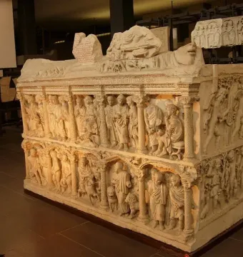 The Sarcophagus of Junius Bassus with two tiers of carved figures in arched architectural panels.