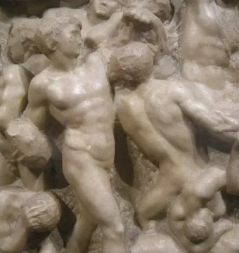 Marble relief of Michelangelo’s Battle of the Centaurs showing nude figures locked in a vigorous struggle.