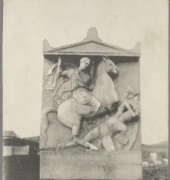 Stele of Dexileus showing a rider on horseback above a fallen figure, with printed captions along the bottom.