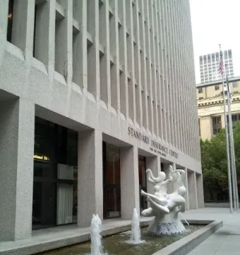 The Quest, a white sculptural fountain with intertwined human figures in a rectangular pool.