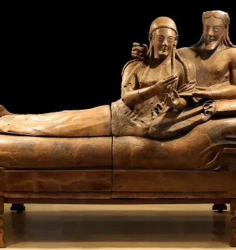 Sarcophagus of the Spouses showing a smiling man and woman reclining together on a banqueting couch.