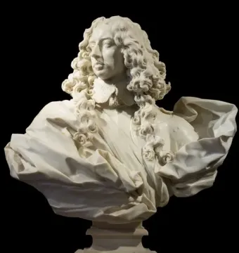 Marble bust of Francesco I d\'Este with curly hair, a ruffled collar, and draped armor-like clothing.