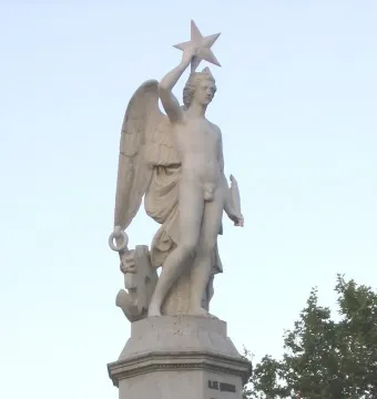 Genio Catalán fountain sculpture of a winged male figure holding a star overhead.