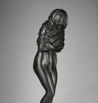 Winter, a dark bronze female figurine wrapped in heavy drapery and standing on a circular base.