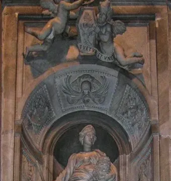 Marble tomb monument to Countess Matilda of Tuscany with a draped female figure in an arched niche, flanked by putti and a crest.