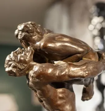 Close-up of the bronze sculpture I Am Beautiful showing two intertwined figures.